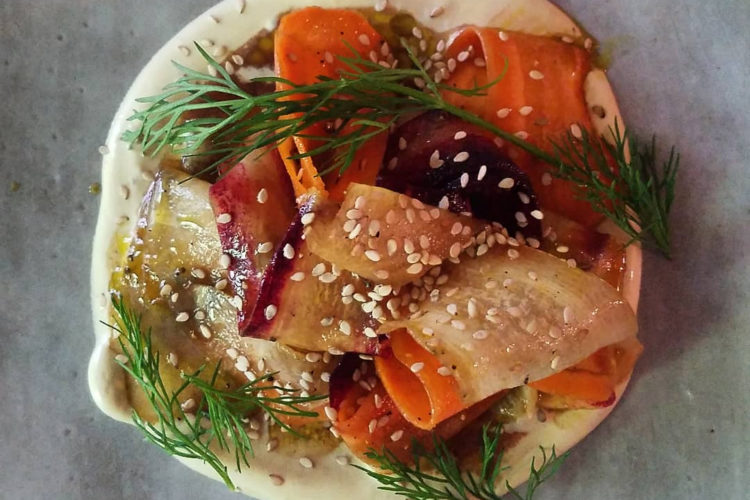 Tangle of Heirloom Carrots in a Pomegranate Molasses Vinaigrette atop Tangy Sour Cream, Garnished with Dill & Sesame Seeds